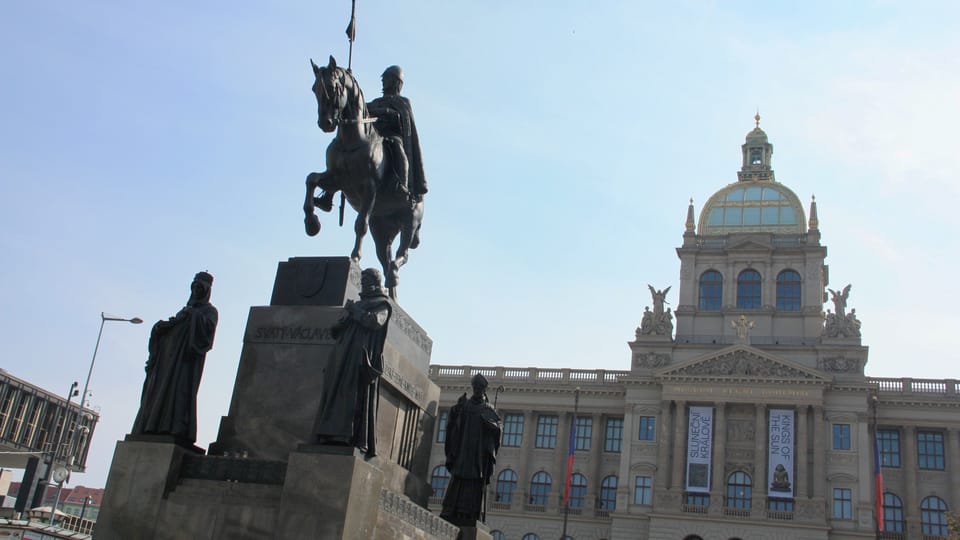 The famous equestrian statue is surrounded by the statues of four saints. They are St. Ludmila, St. Prokop, St. Vojtěch and St. Agnes | Photo: Barbora Němcová, Radio Prague International The famous equestrian statue is surrounded by the statues of four saints. They are St. Ludmila, St. Prokop, St. Vojtěch and St. Agnes | Photo: Barbora Němcová, Radio Prague International